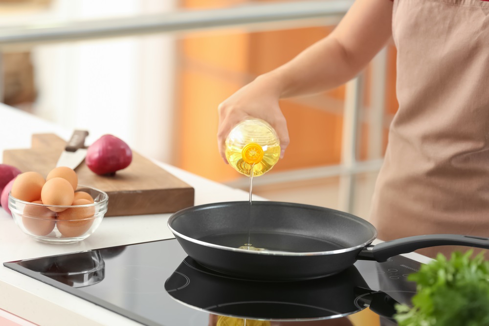 Woman Frying pan oil