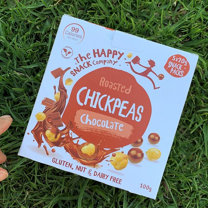 Choc Chickpeas HappySnackCo grass hand