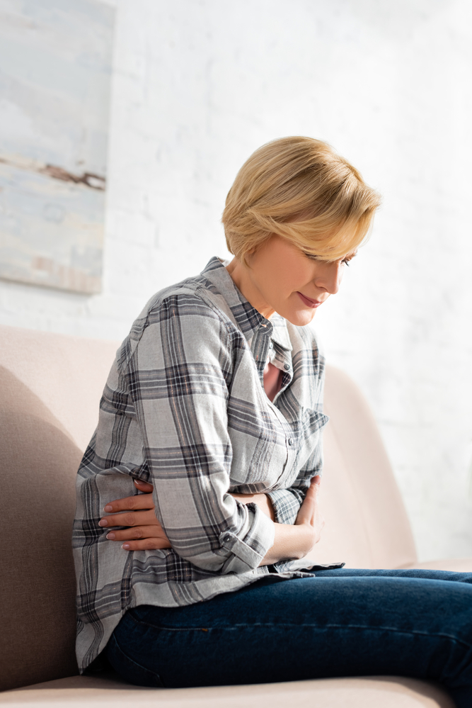 Woman Holding Liver pain